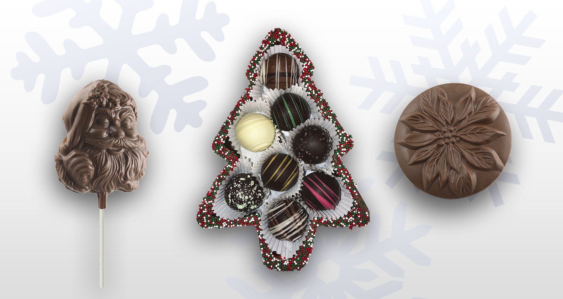 Christmas slide with an Old Time Santa Face Pop, Truffle chocolates in a chocolate tree container, and molded poinsettia chocolate